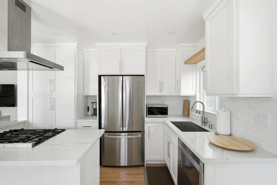 Fully equipped kitchen with modern appliances and ample counter space for cooking at home