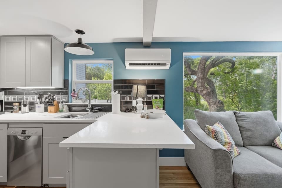 Cozy open-concept living with fully equipped kitchen and comfortable seating area