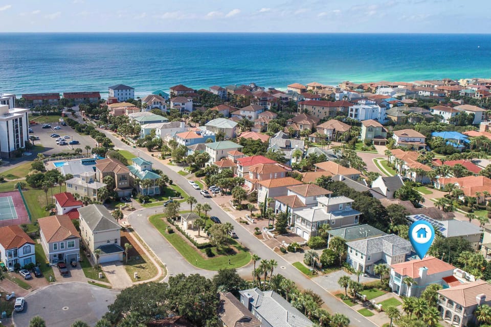Scenic Aerial Beach View

An elevated panoramic perspective highlighting the beautiful coastal neighborhood layout. A blue icon marks the home's premier location, showcasing its incredible proximity to the turquoise ocean waters.