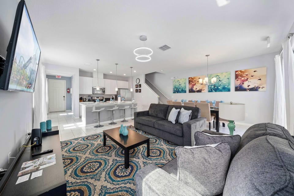 Open-concept great room-comfy sofas, stylish art, and a breakfast bar for four-perfect for movie nights and shared meals.