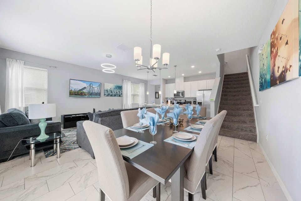 Gather in this open-concept great room-dining for 8, comfy sofas, and a sleek kitchen all in one bright, modern space.