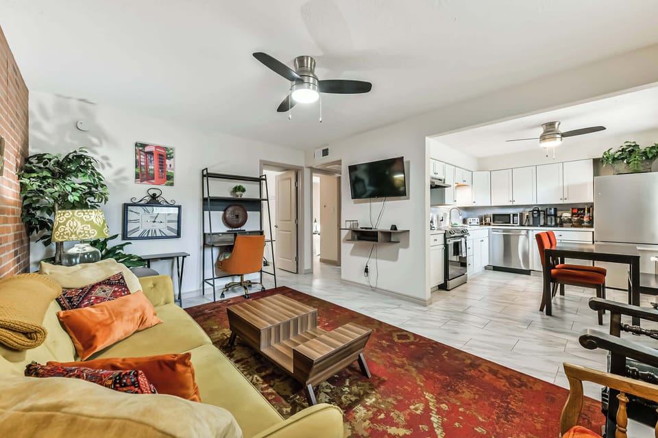 Relax in this cozy living room featuring a smart TV and pull-out bed—perfect for couples, families with kids, or guests traveling with pets.