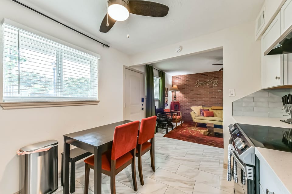 Fully equipped kitchen with stainless steel appliances, sleek quartz counters, and everything you need to cook and dine in comfort.