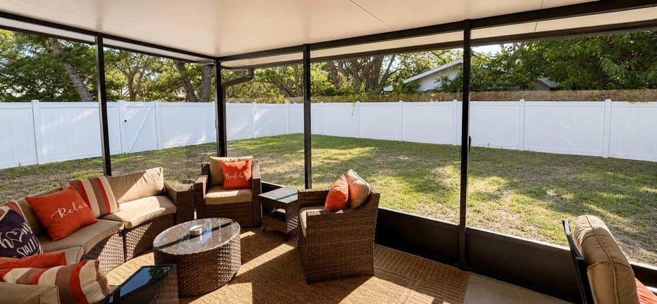 Enjoy a relaxing and comfortable outdoor experience in our private screened-in backyard patio — the perfect space to unwind morning or night. The backyard features a spacious covered lanai with comfortable seating, cozy décor, and a dining area ideal