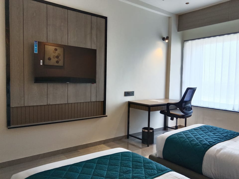 Deluxe Twin Room, City View | In-room safe, iron/ironing board, free WiFi