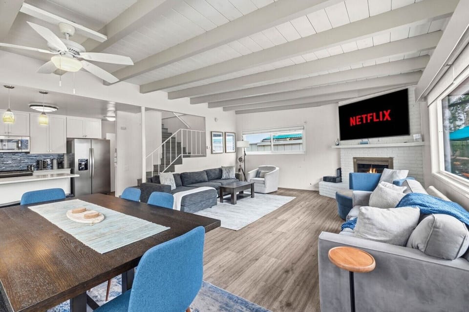 Open living and dining area with vaulted ceilings, Smart TV, and plenty of space for the whole group.
