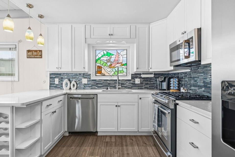 Fully equipped kitchen with modern appliances, ample counter space, and everything you need to cook at home.