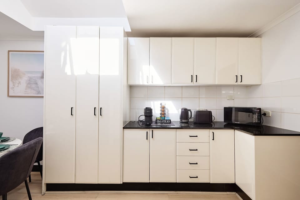 Modern kitchen featuring sleek cabinetry, ample storage, and clean contemporary finishes designed for everyday practicality.