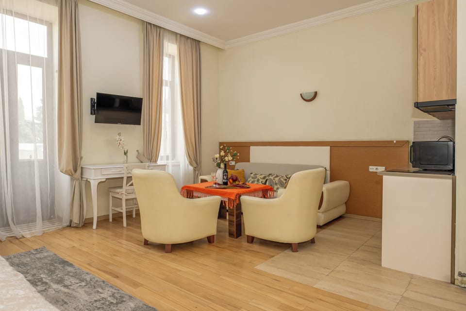 Studio, City View | Living area | 37-inch LCD TV with digital channels