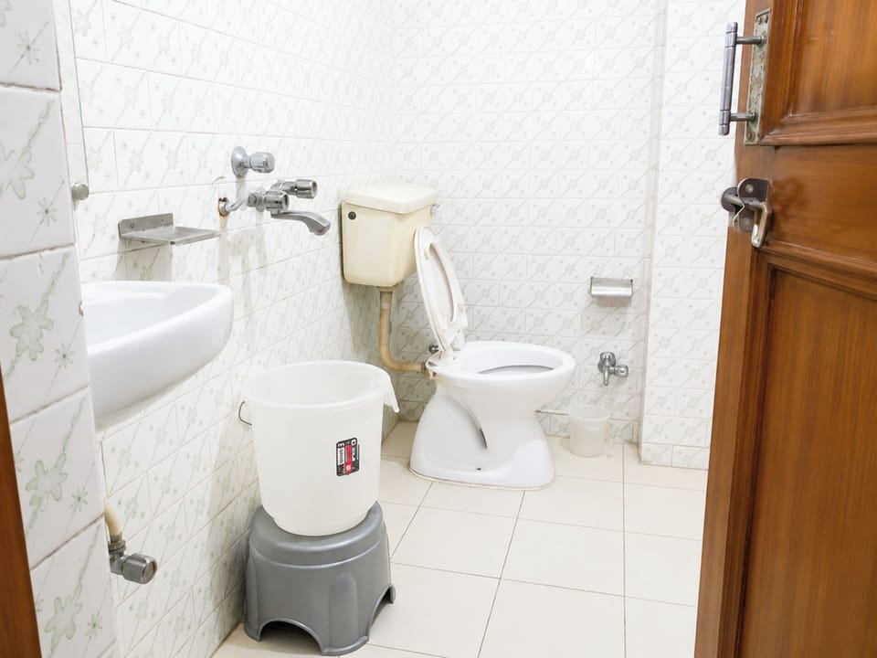 Shower, rainfall showerhead, slippers, towels