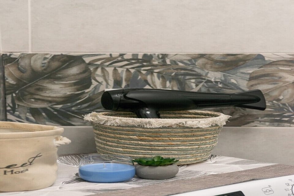 Bathroom essentials including hairdryer and thoughtful guest amenities provided.
