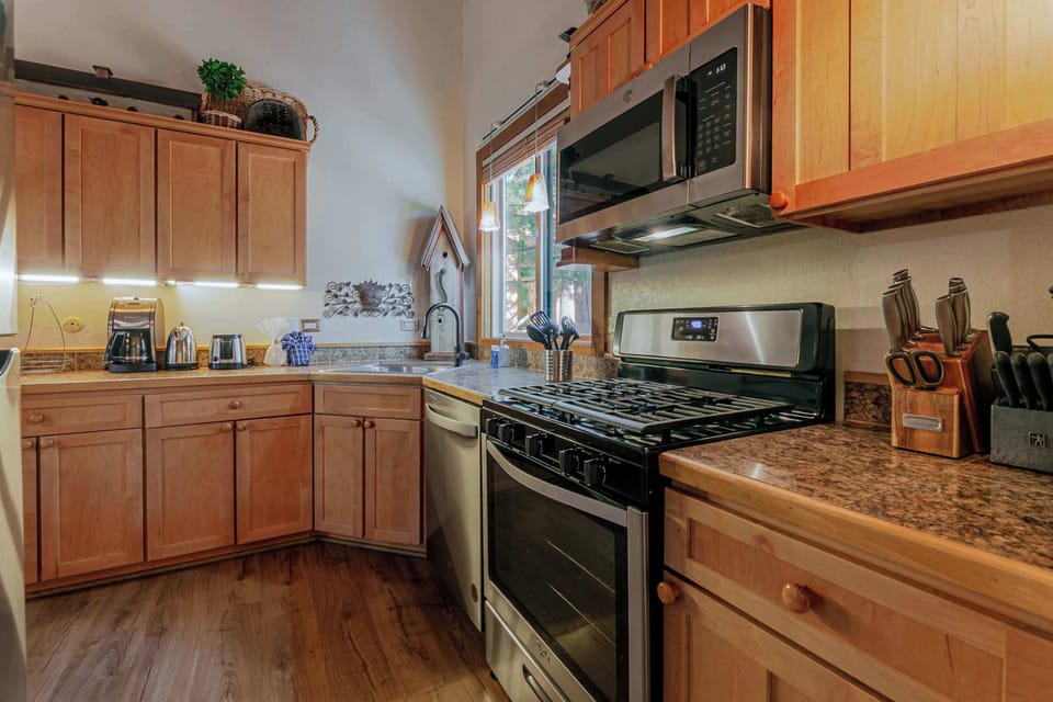 The open kitchen offers ample space & all the comforts of home​