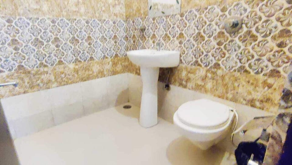 Shower, rainfall showerhead, slippers, towels