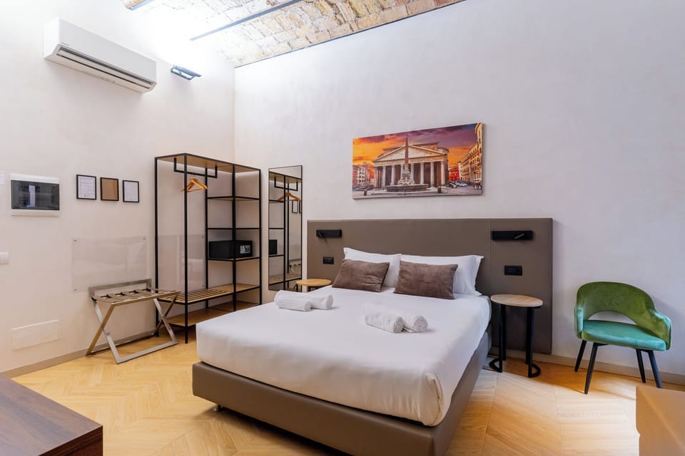 Deluxe Triple Room, Courtyard View | Minibar, in-room safe, desk, soundproofing