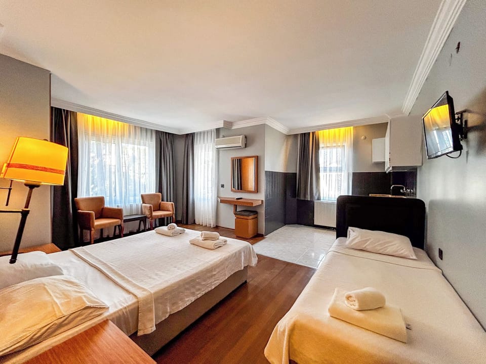Standard Triple Room, Balcony | Desk, laptop workspace, iron/ironing board, free WiFi
