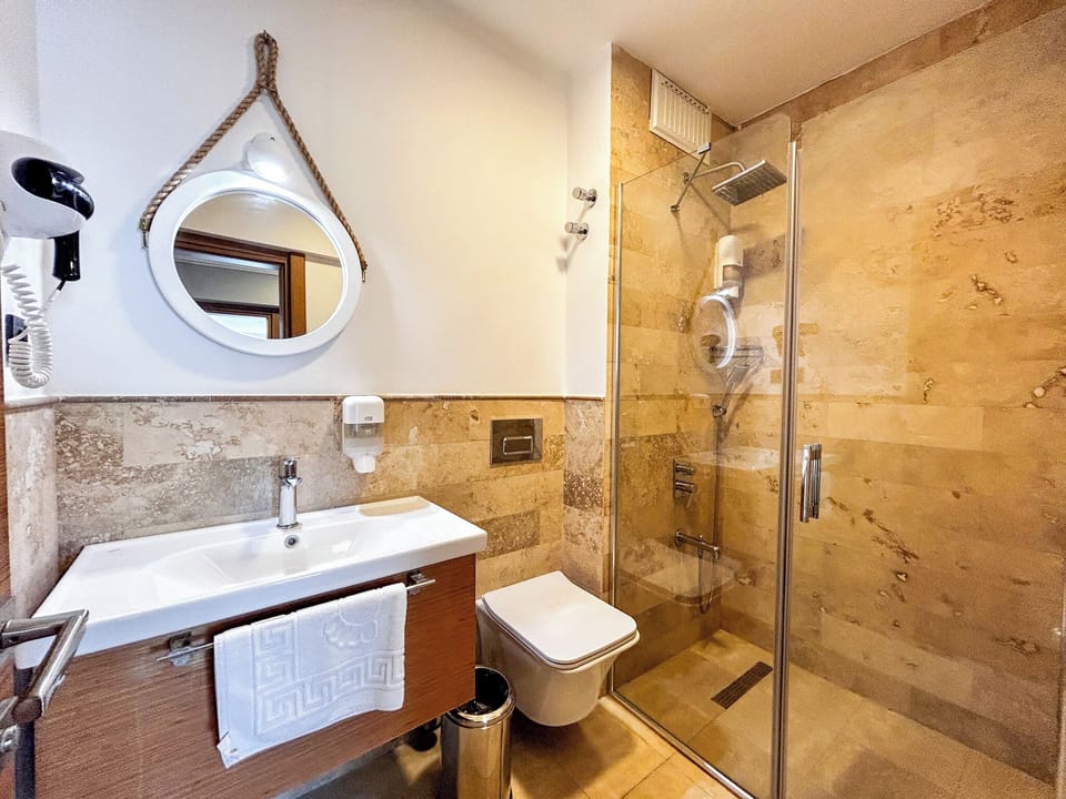 Family Suite, Balcony, Sea View | Bathroom | Shower, hair dryer, towels, soap