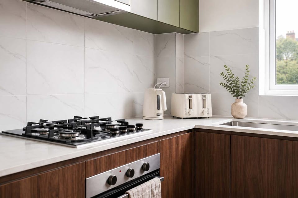 Fully equipped kitchen with modern appliances, generous bench space, and everything needed for preparing meals during your stay. The practical layout makes cooking easy whether you're making breakfast or dinner.
