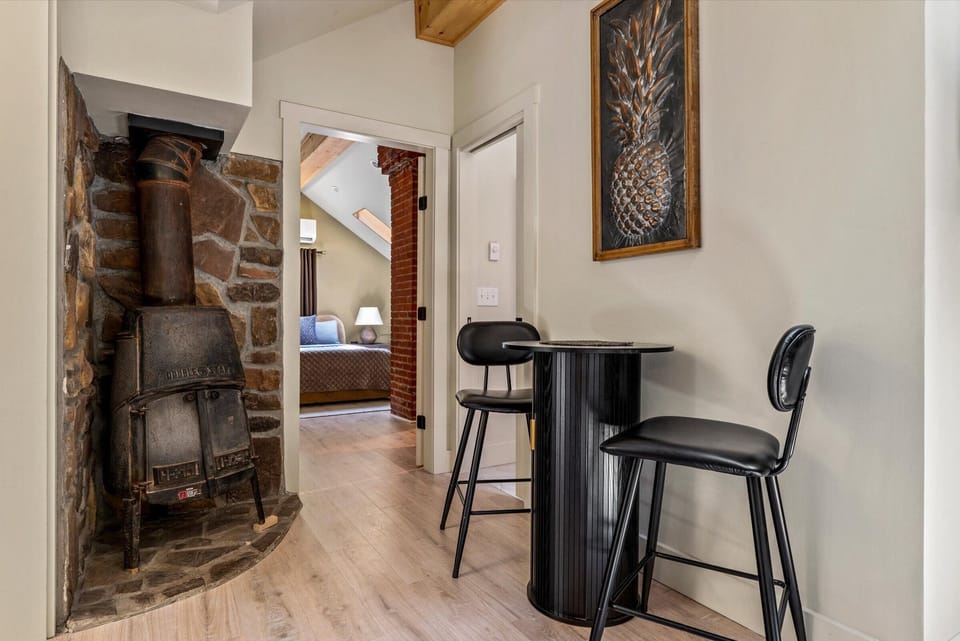 The Penthouse: Exposed Clay Brick Fireplace (not operational).