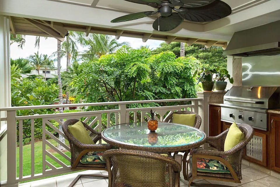 Lanai with table, chairs and built in BBQ with garden/pool view