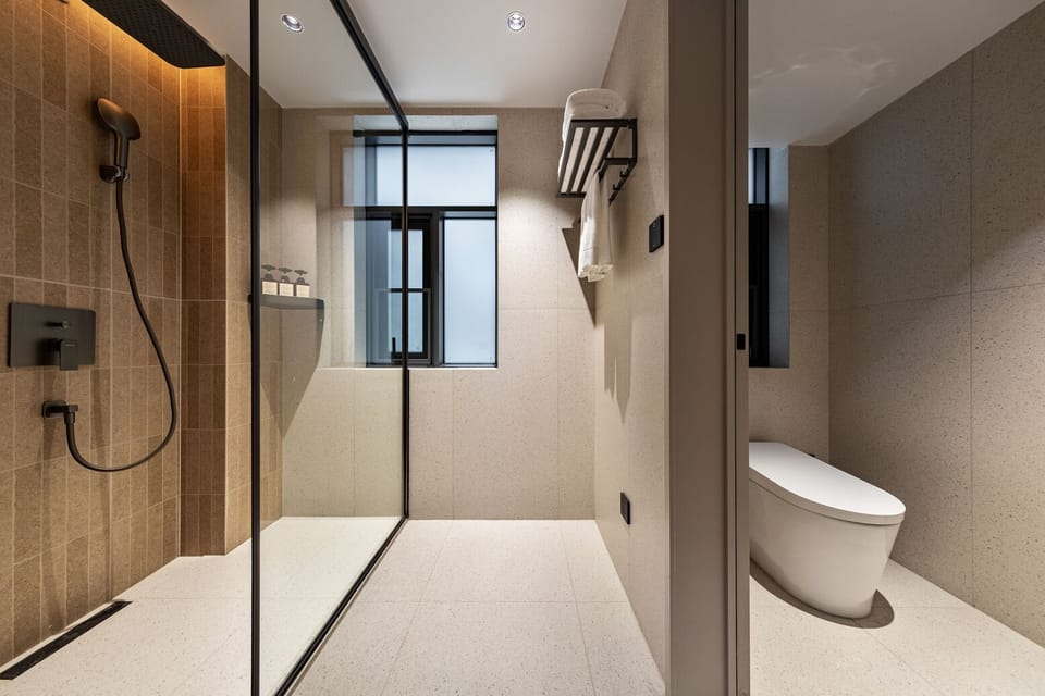 Shower, free toiletries, hair dryer, slippers
