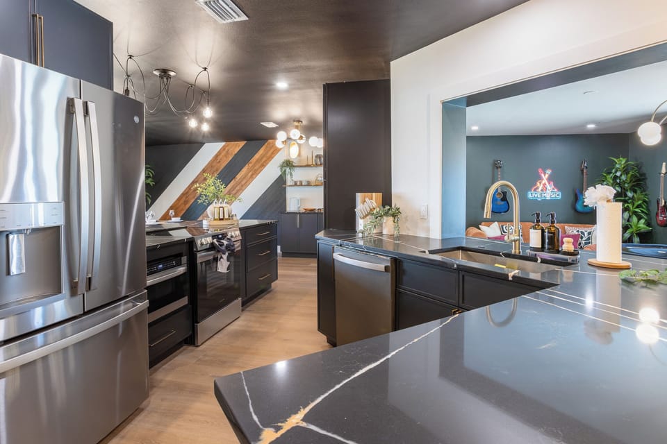 Full kitchen with fridge, oven, microwave, dishwasher and fully stocked kitchen essentials
