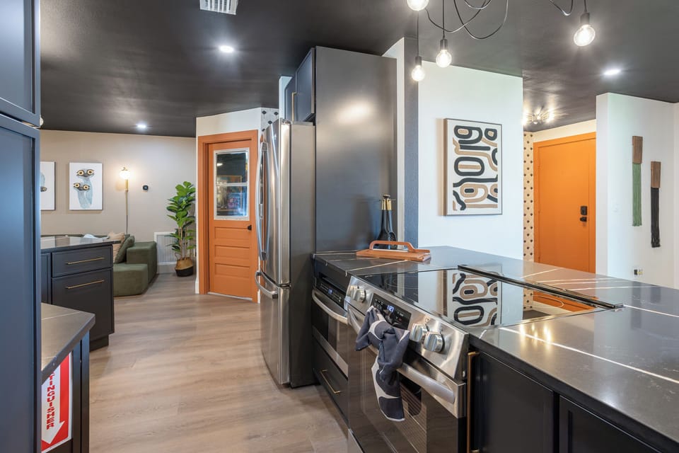 Full kitchen with fridge, oven, microwave, dishwasher and fully stocked kitchen essentials