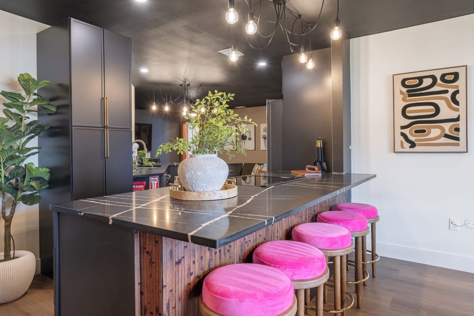 Kitchen view from dining room with breakfast bar and bar stool seating, perfect for enjoying family meals