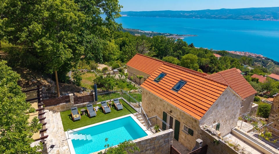 This traditional stone villa is nestled among oak trees at the top of Krug Street.