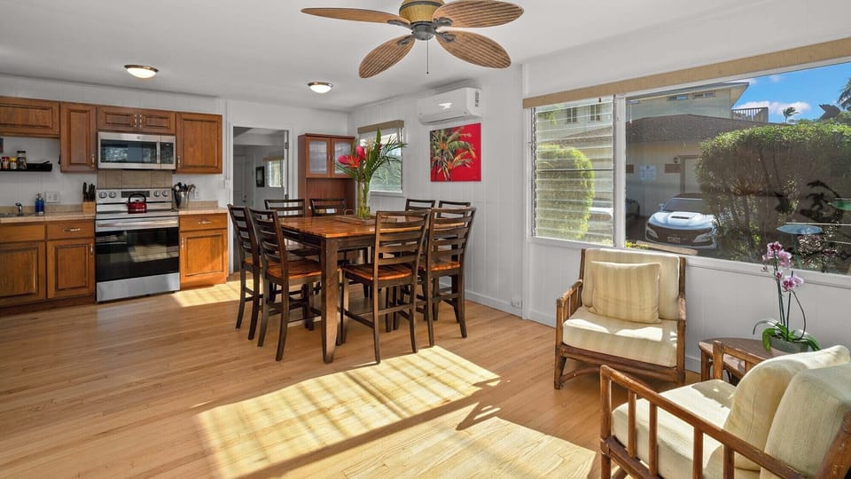Relax in your bright, open-plan retreat where warm wood tones meet modern comfort, perfect for memorable meals and peaceful moments together.
