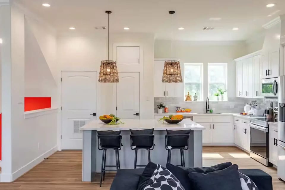 A perfect view from the living room couch looking into the spacious kitchen.
