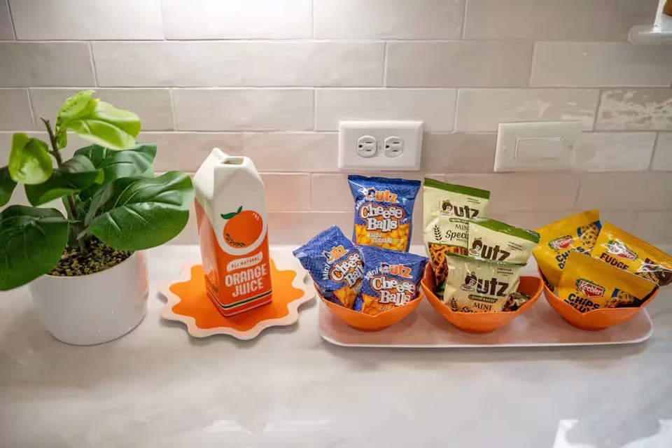 Complimentary snacks and orange juice ready for you to enjoy.