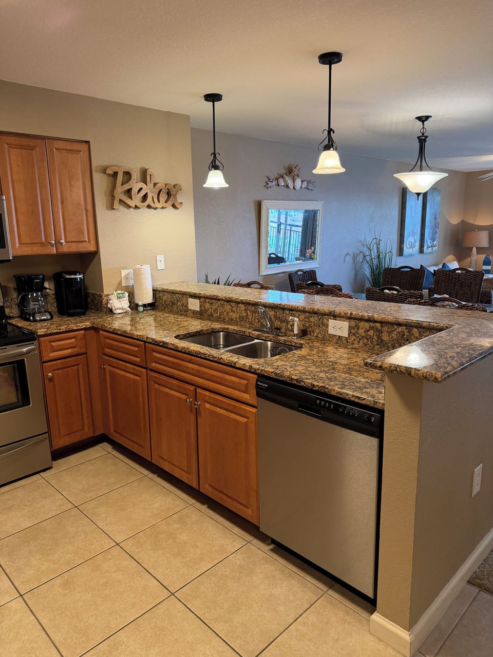 Your gourmet kitchen awaits with granite countertops, warm wood cabinets, and modern appliances perfect for creating memorable meals together.