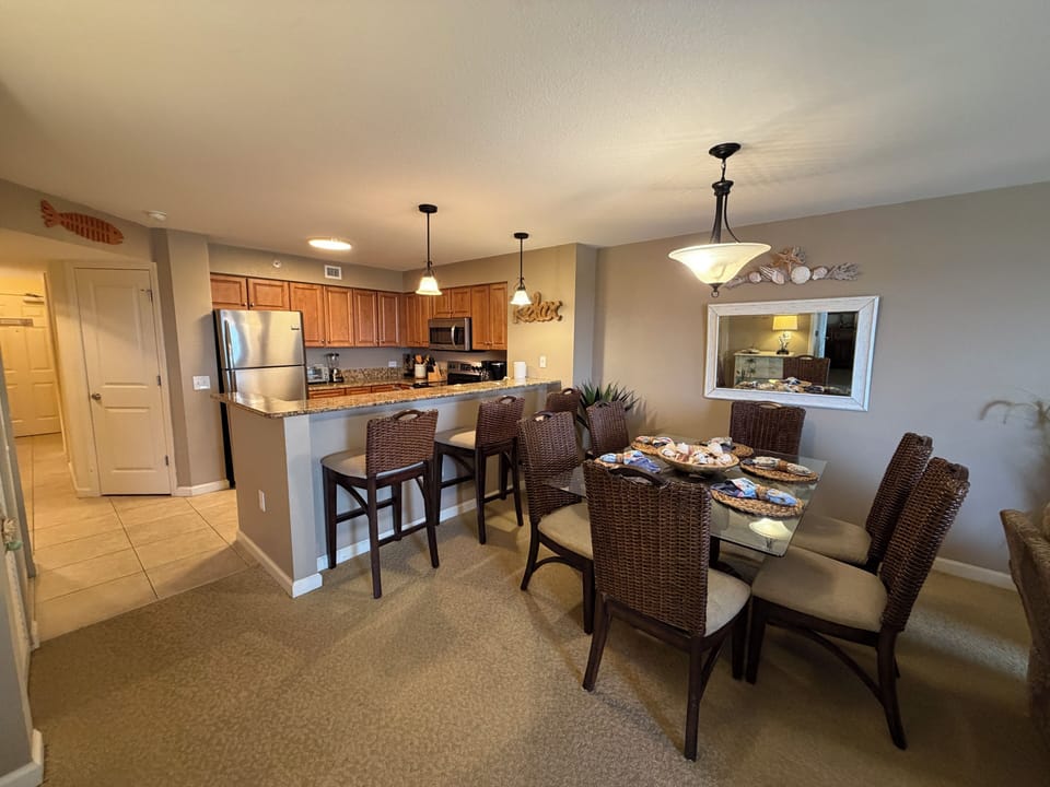 Gather around your spacious dining table for memorable meals, while the fully equipped kitchen with granite counters makes cooking together a joy.