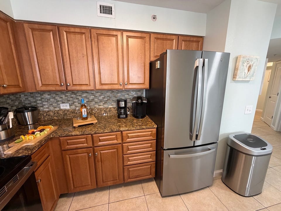 Your fully equipped kitchen features granite counters, stainless steel appliances, and everything you need to prepare meals during your stay.