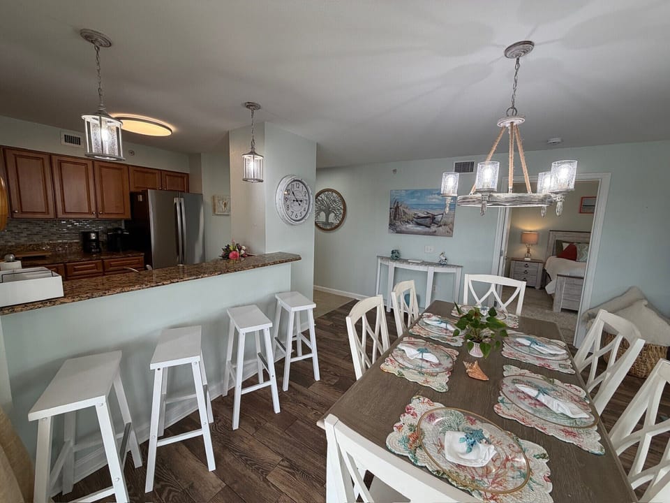Your open-concept kitchen and dining space welcomes family gatherings with granite counters and seating for eight.
