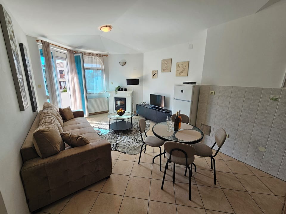 Basic Apartment, Sea View | Living area | 15-inch flat-screen TV with cable channels, fireplace, table tennis