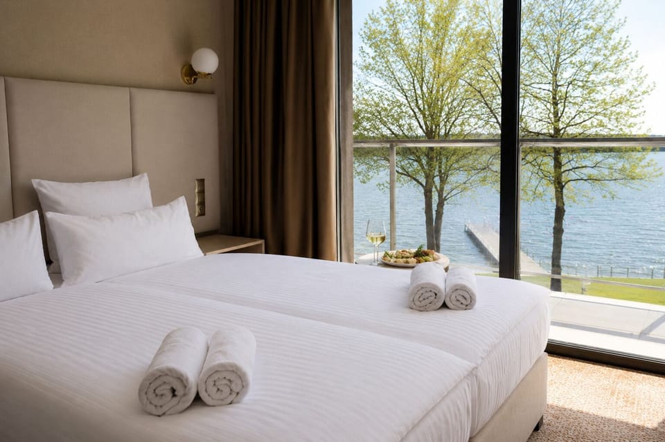Superior Suite, Balcony, Lake View | Desk, laptop workspace, WiFi (free), bed sheets