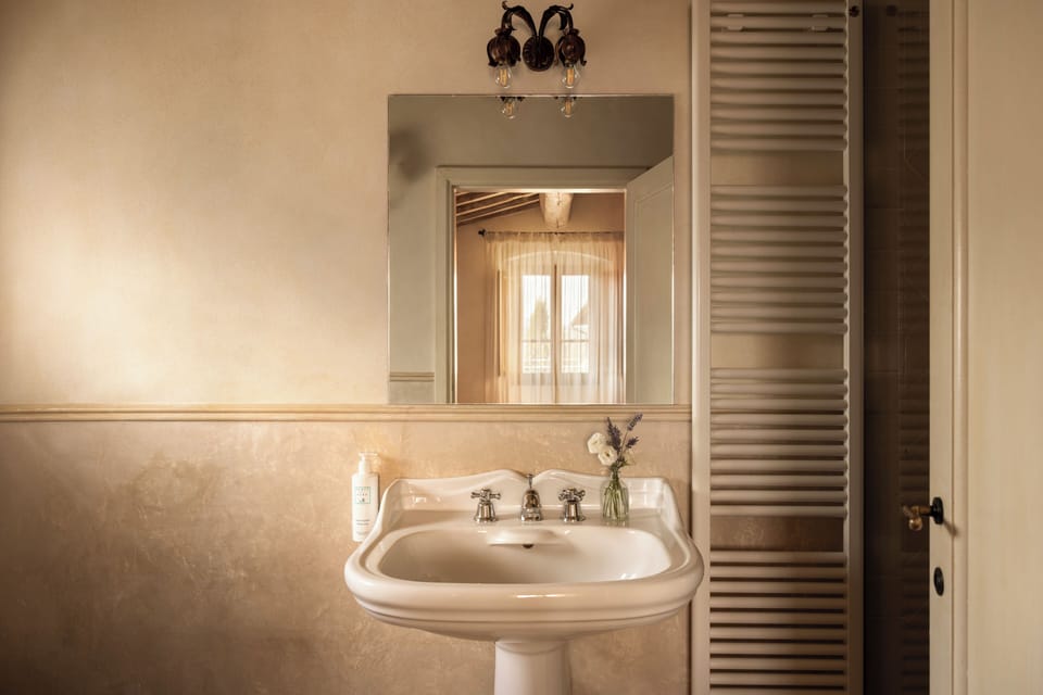 Junior Suite | Bathroom | Hair dryer, slippers, towels, soap
