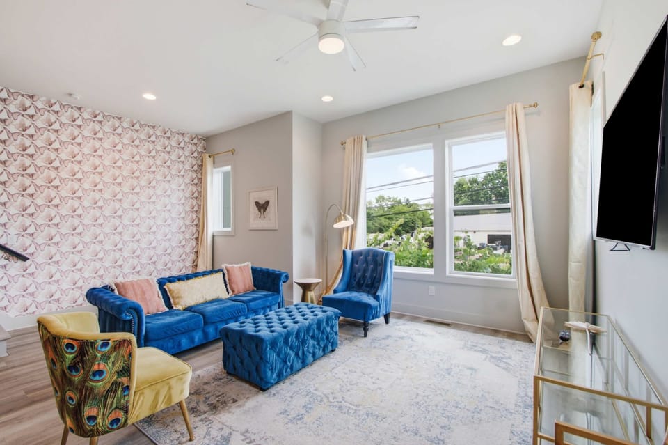 Brightly styled retreat with plush blue seating and vibrant accents, perfect for relaxation!