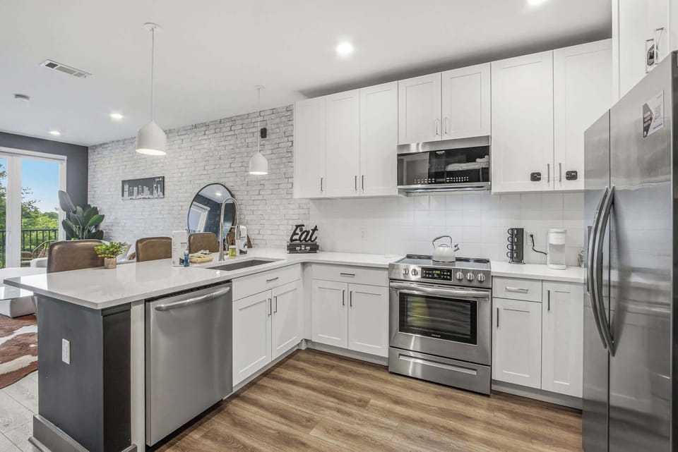 Modern Kitchen, sleek stainless appliances and a bright atmosphere perfect for culinary adventures!