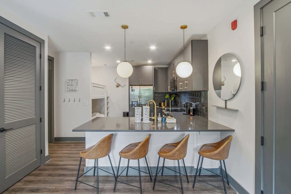 Sleek Kitchen, enjoy culinary adventures in this modern kitchen with stylish seating and bright lights!