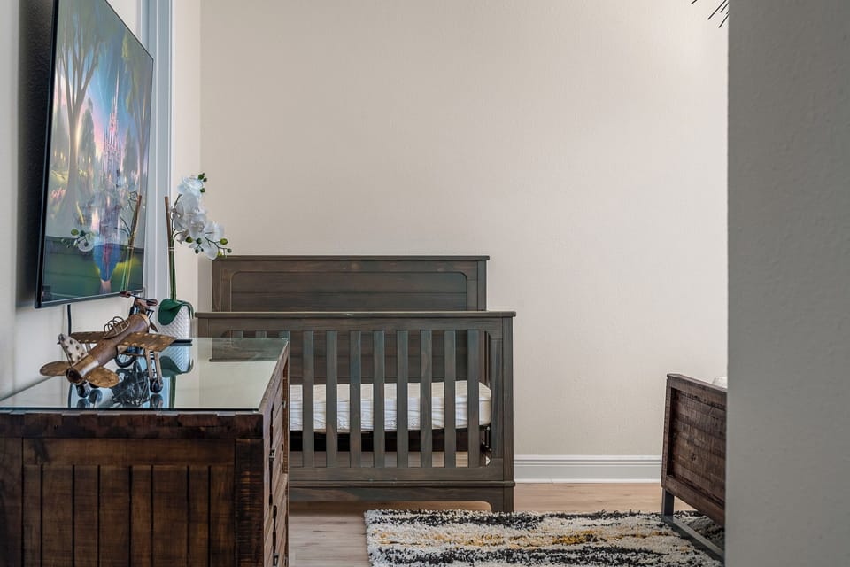 Stylish master suite with rustic wood accents and soft lighting