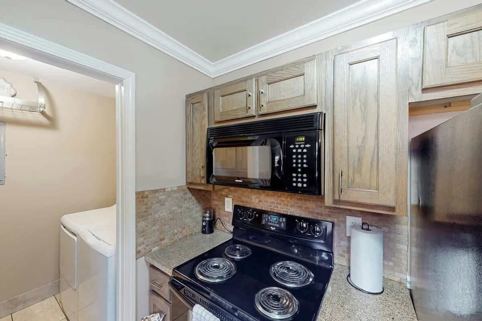 Kitchen Oasis, modern appliances and sleek granite countertops for effortless cooking adventures!