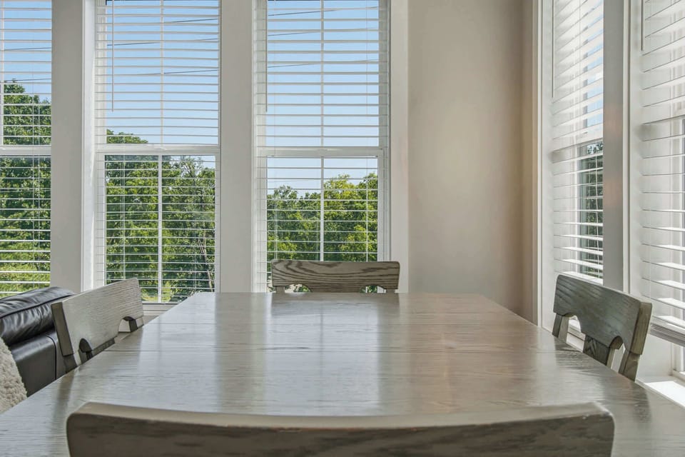 Dining Room, bright and airy space for meals, featuring views through large windows! Enjoy!