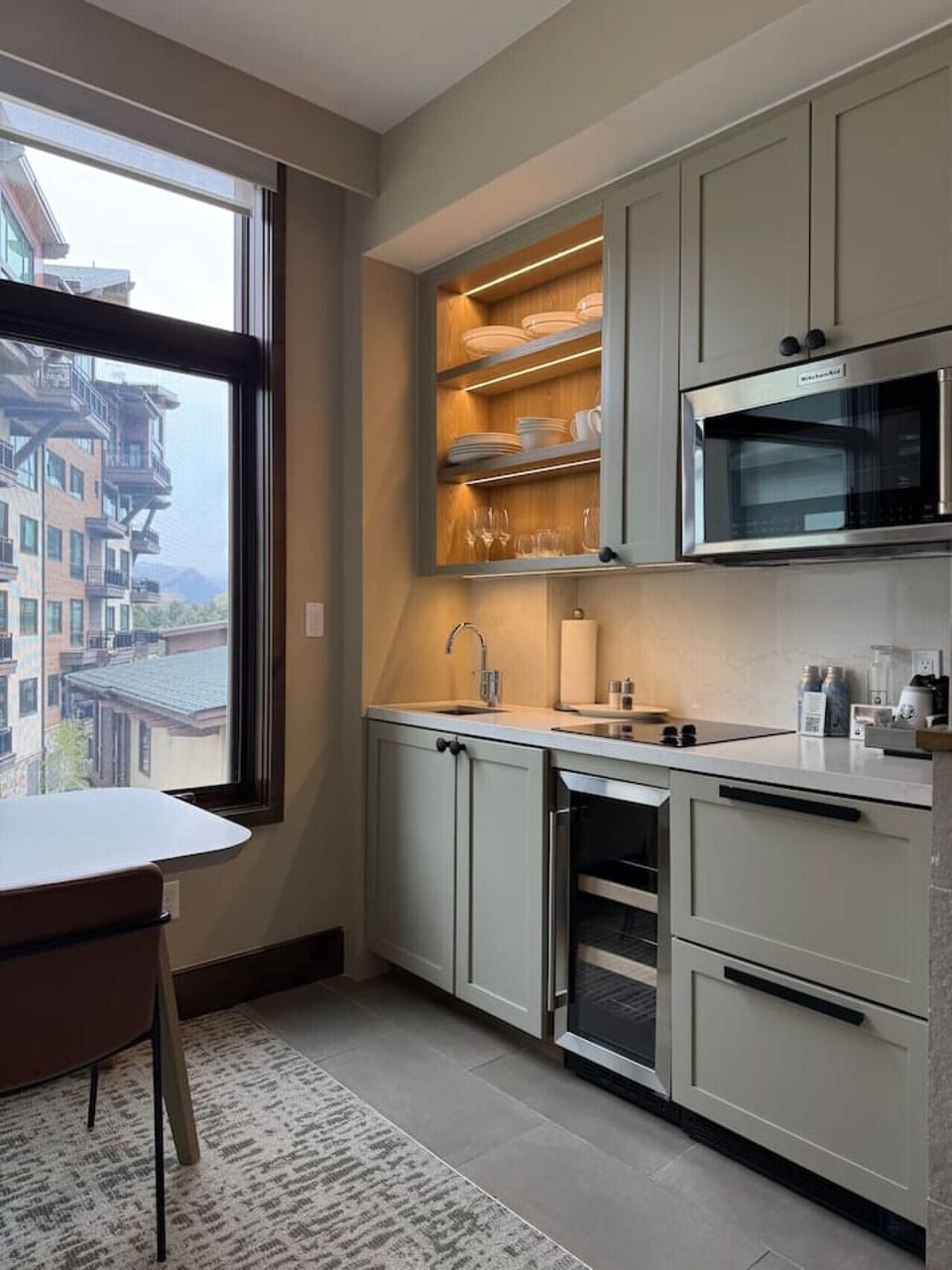 Kitchenette with cooktop, microwave, coffee maker, and mini fridge