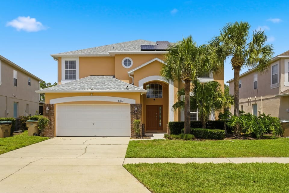 Beautiful curb appeal welcomes you to your private Florida retreat inside Emerald Island Resort