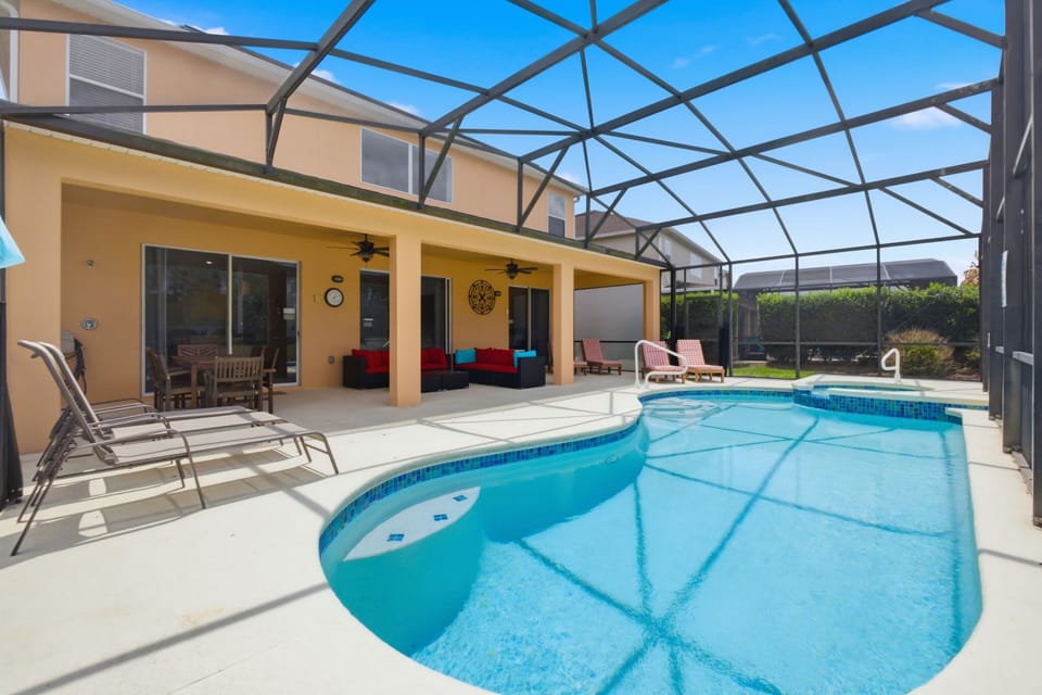 Private screened-in pool and spa with plenty of lounge seating—perfect for soaking up the Florida sunshine.