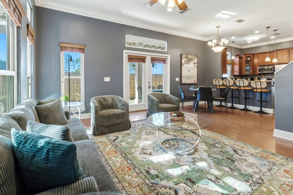 Sun-filled living room with fireplace and smart TV
