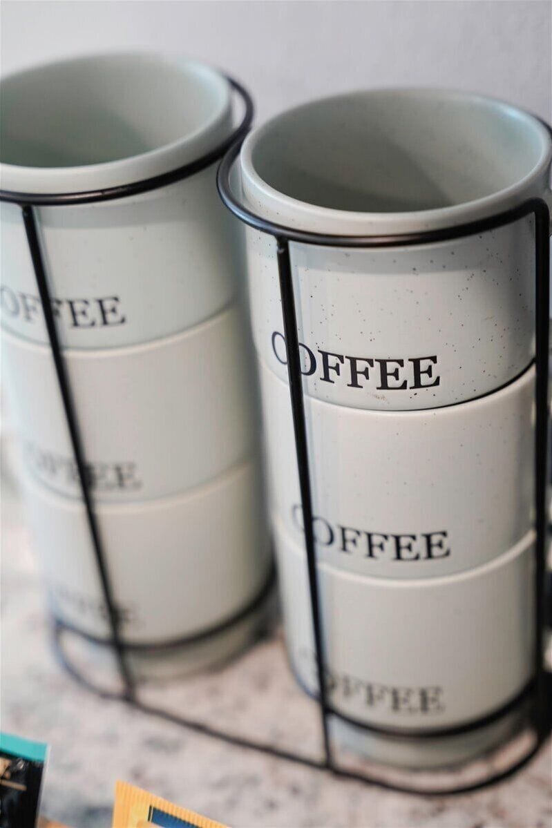 Organized coffee station with stylish stacked mugs for easy morning brews