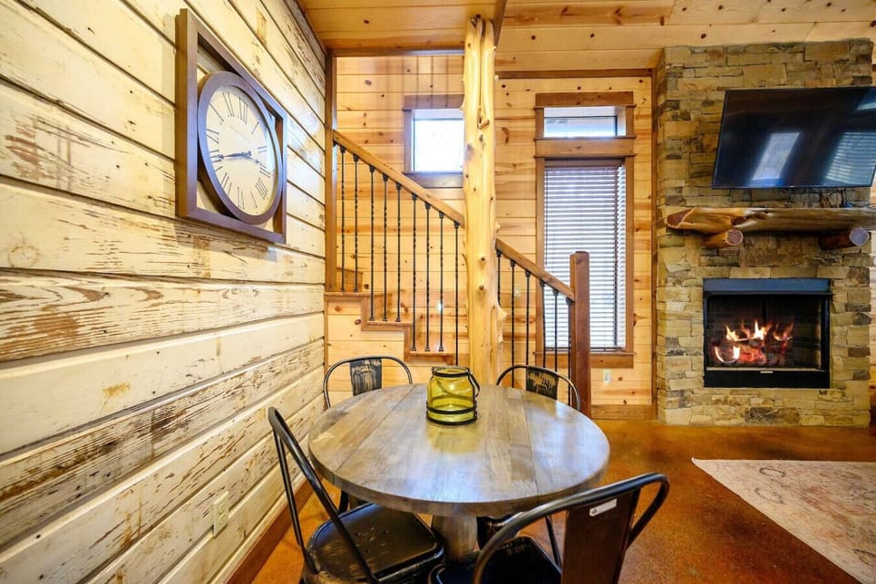 Charming dining space with rustic table and seating for four guests.